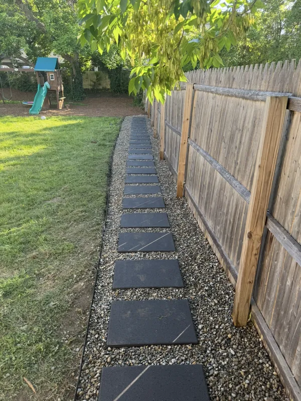 Backyard Paver Path in Haddon Township, NJ — Square pavers set in a clean gravel band carry the path along the fence line.